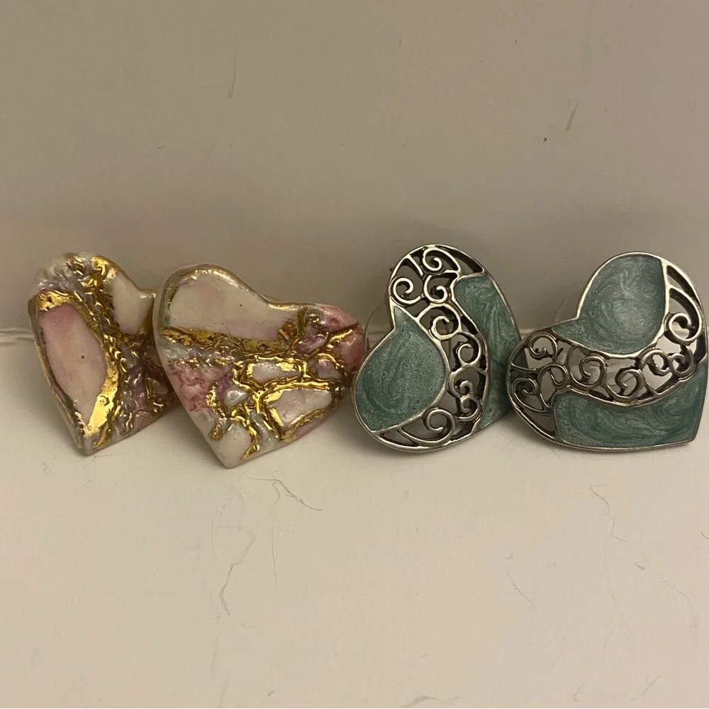 Two sets of heart earrings. Post earrings